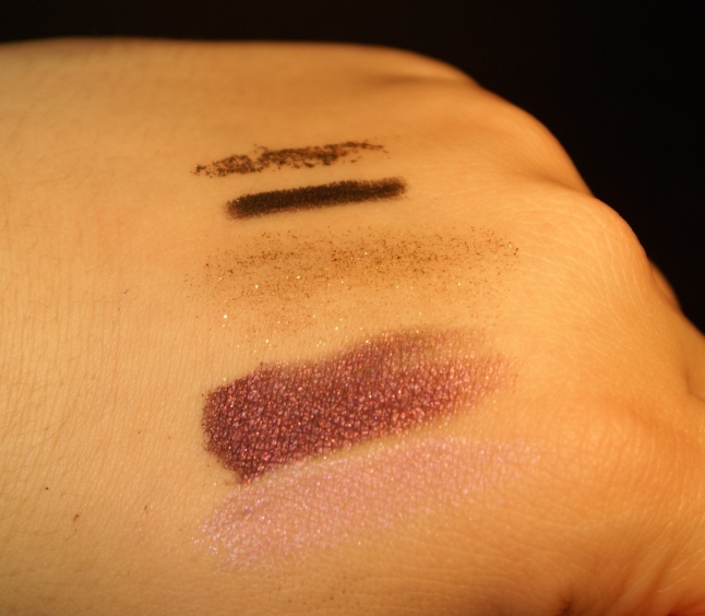 From top to bottom: Urban Decay Midnight Cowboy Liner, Smashbox 3D Sparks Liner, MAC Gold Glitter, Sigma Beauty Supernatural and Felicity